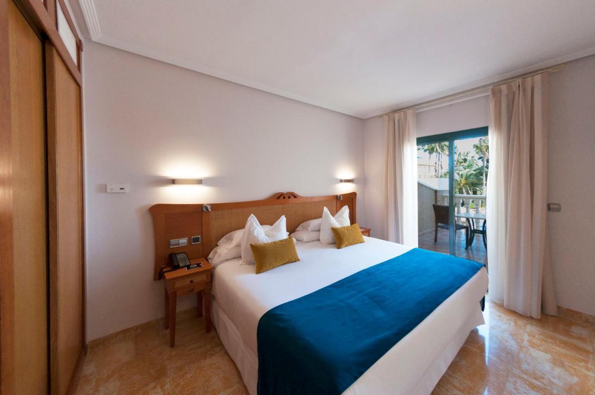 Cama o camas de una habitación en Hotel La Laguna Spa & Golf