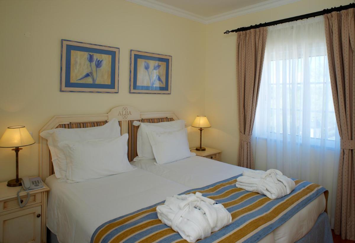Uma cama ou camas num quarto em Vila Alba Resort