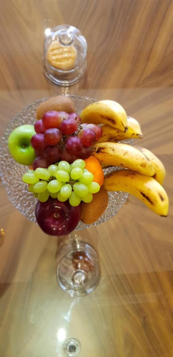 a glass plate of fruit on a table at Radisson Jodhpur in Jodhpur