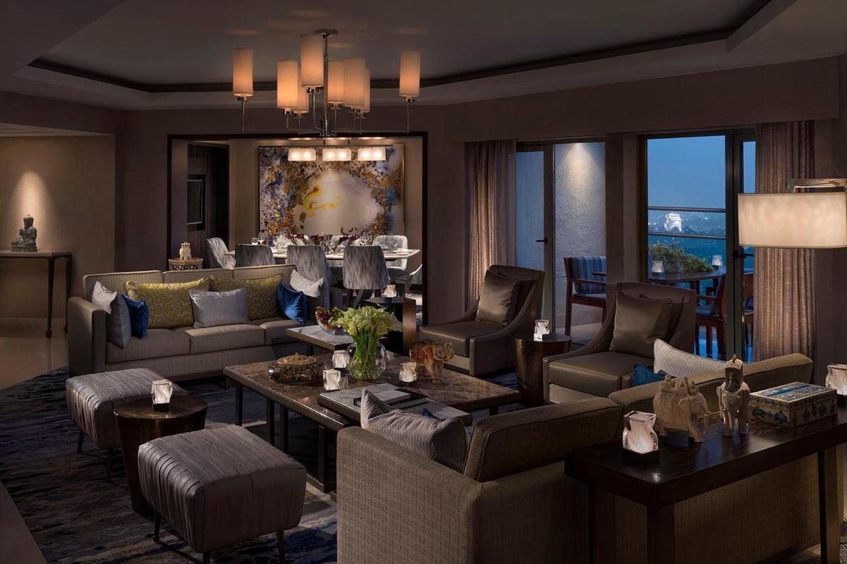 a large living room with couches and chairs at Shangri-La Eros New Delhi in New Delhi a large living room with couches and chairs at Shangri-La Eros New Delhi in New Delhi