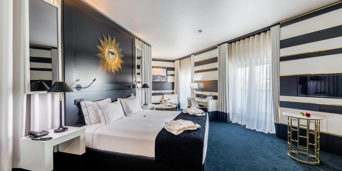 Uma televisão e/ou sistema de entretenimento em Aurea Fatima Hotel Congress & Spa