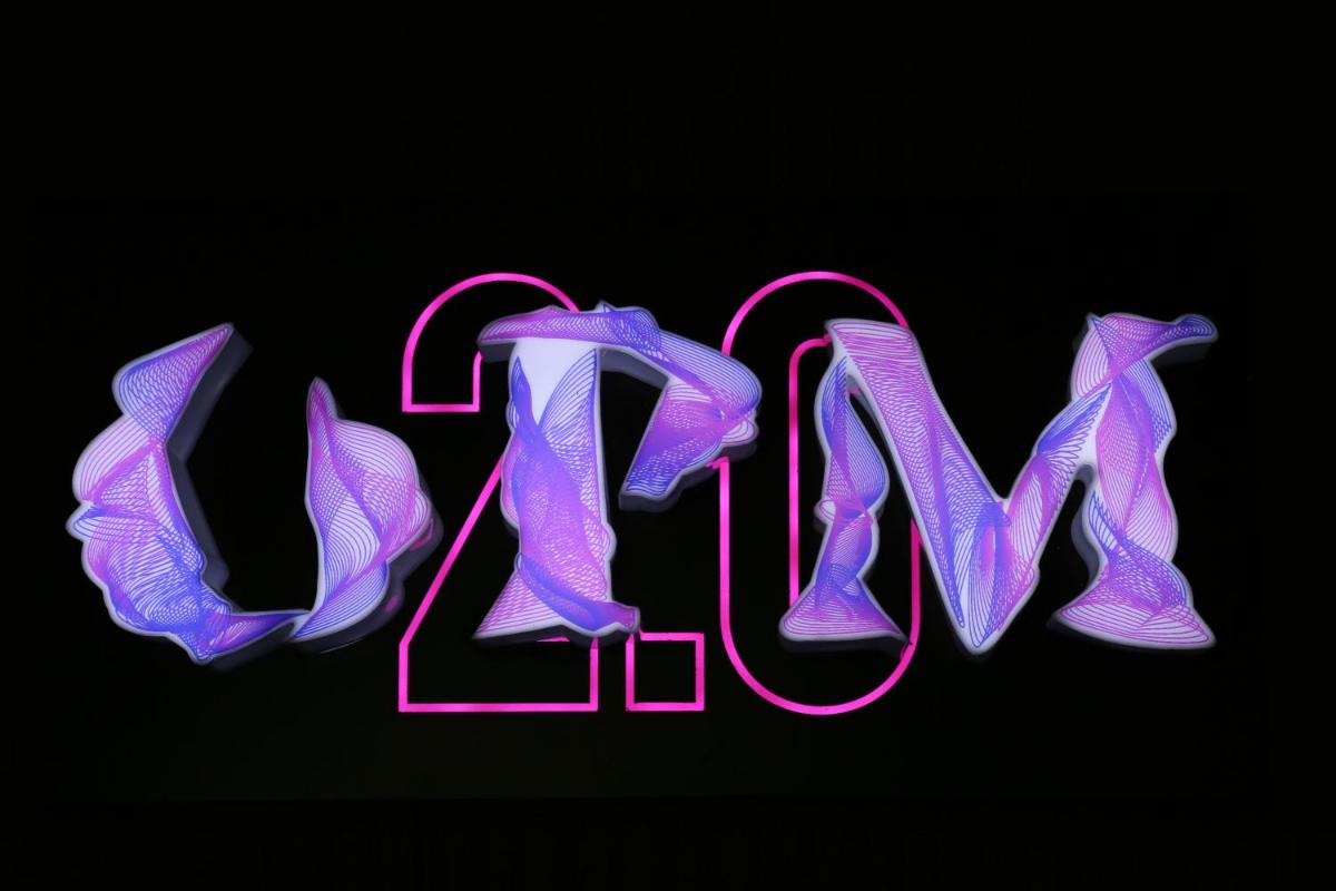 a neon sign that says rave written in purple and pink at The Accord Metropolitan in Chennai