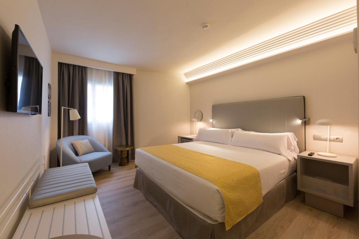 Cama o camas de una habitación en Catalonia Granada