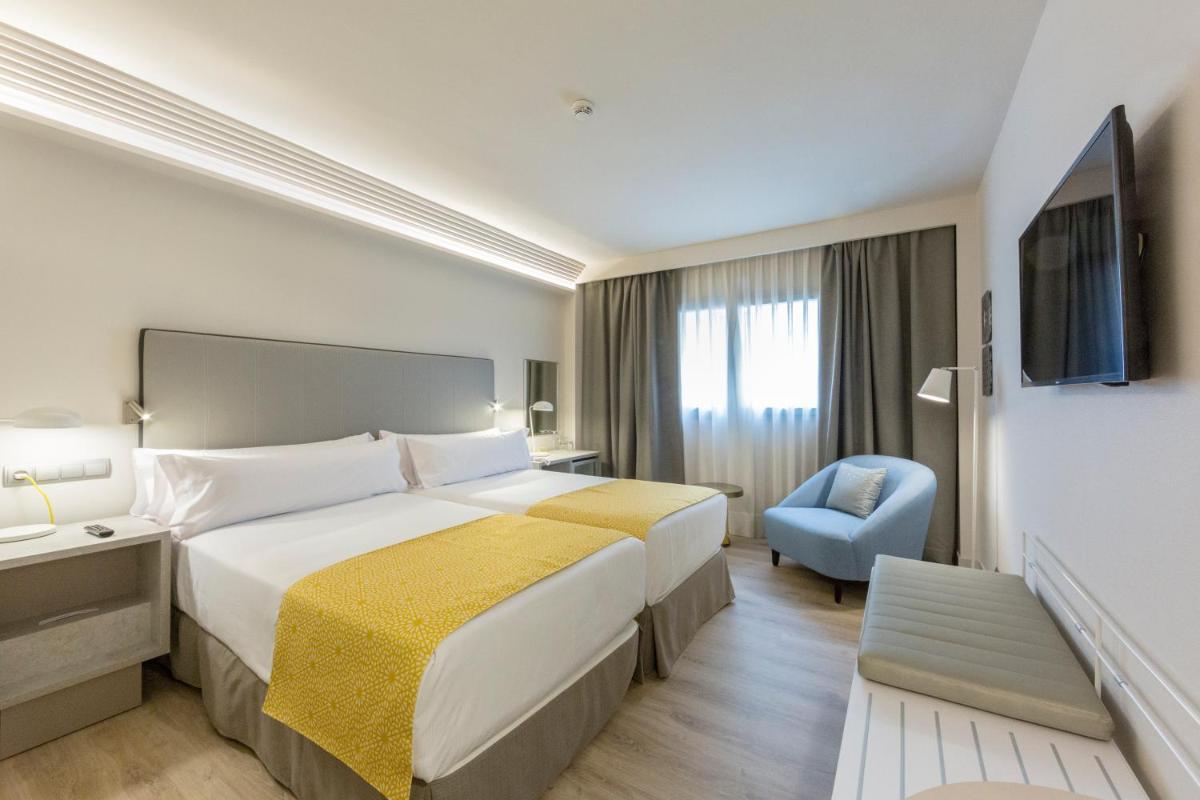 Cama o camas de una habitación en Catalonia Granada