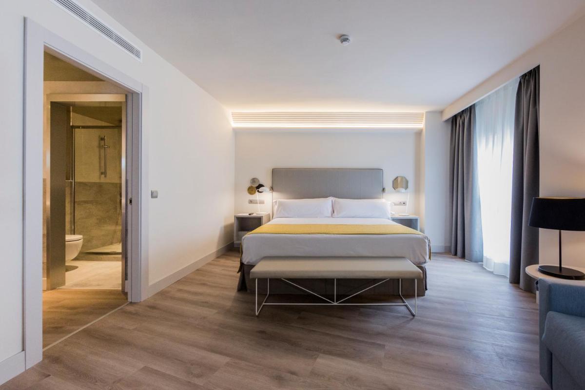 Cama o camas de una habitación en Catalonia Granada