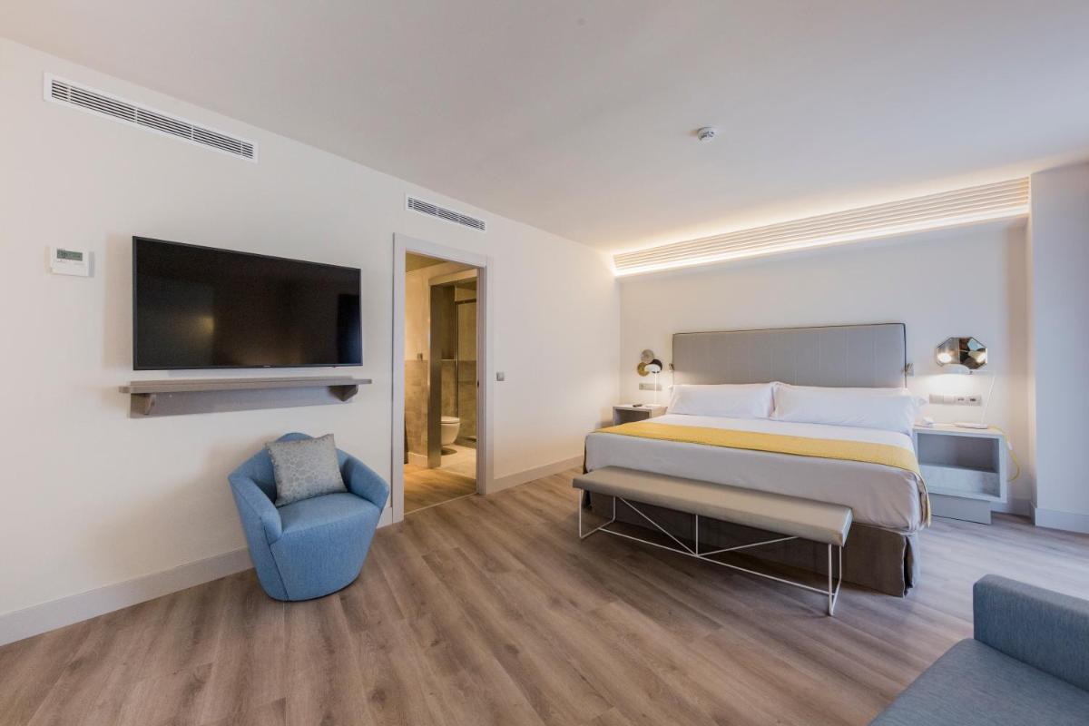 Cama o camas de una habitación en Catalonia Granada