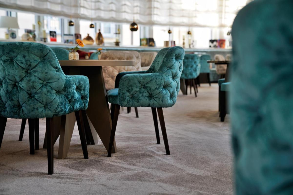 Ein Sitzbereich in der Unterkunft VILA VITA Rosenpark Ein Sitzbereich in der Unterkunft VILA VITA Rosenpark