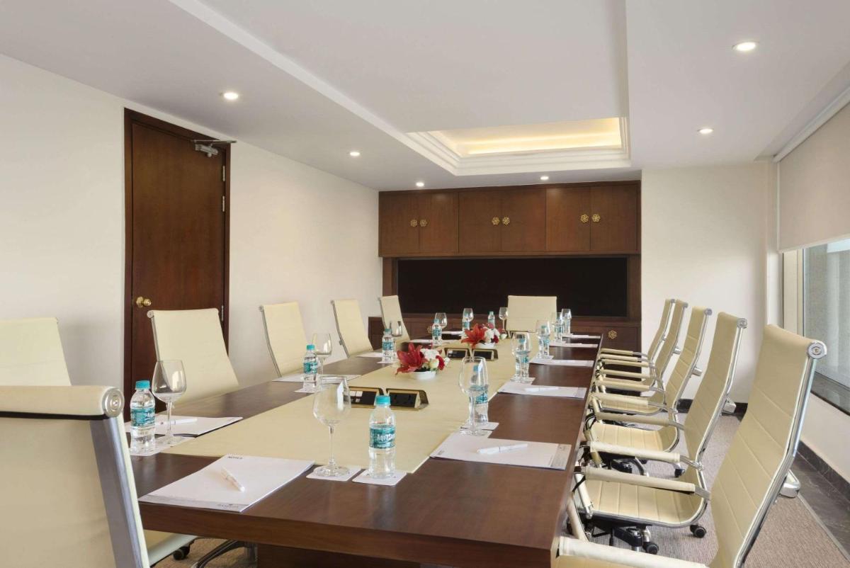 a large conference room with a long table and chairs at Saura Hotel, Agra - A Club Mahindra Associate in Agra