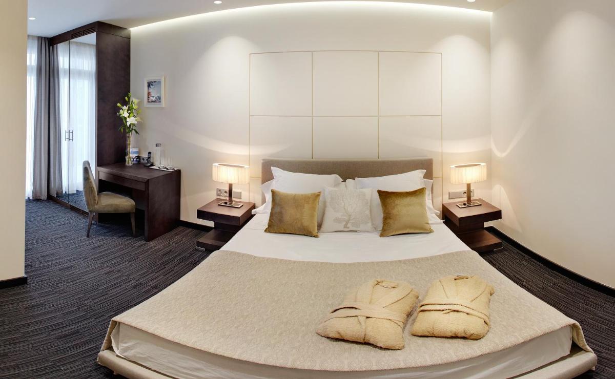 Cama o camas de una habitación en Cosmopolita Hotel Boutique & Spa