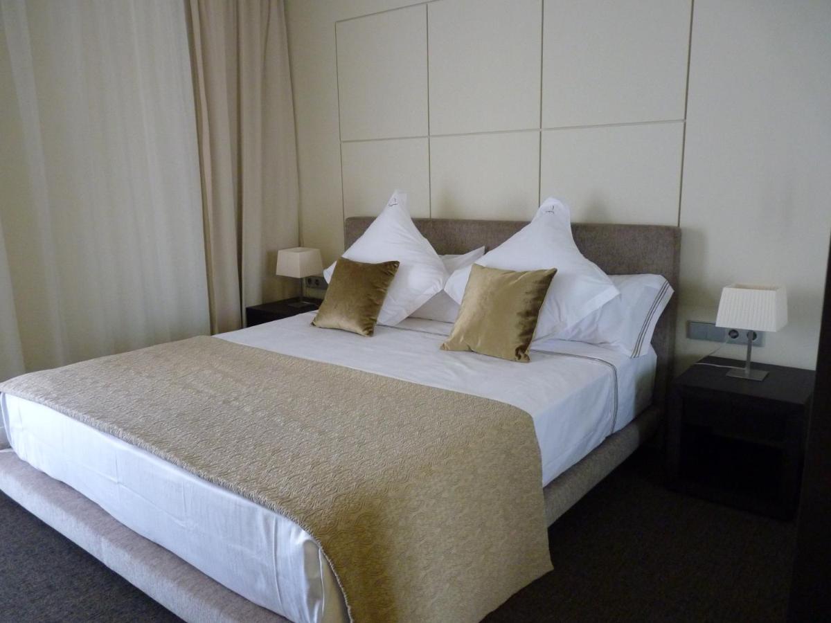 Cama o camas de una habitación en Cosmopolita Hotel Boutique & Spa