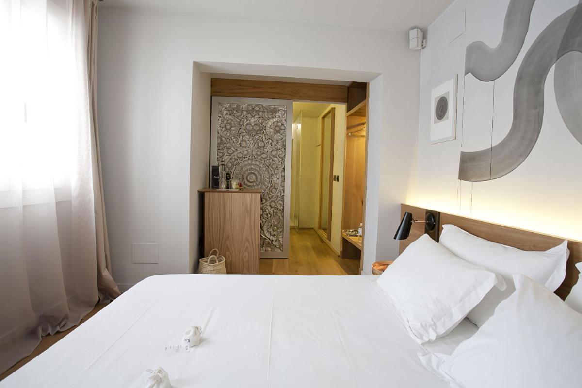 Cama o camas de una habitación en Puro Hotel Oasis Urbano