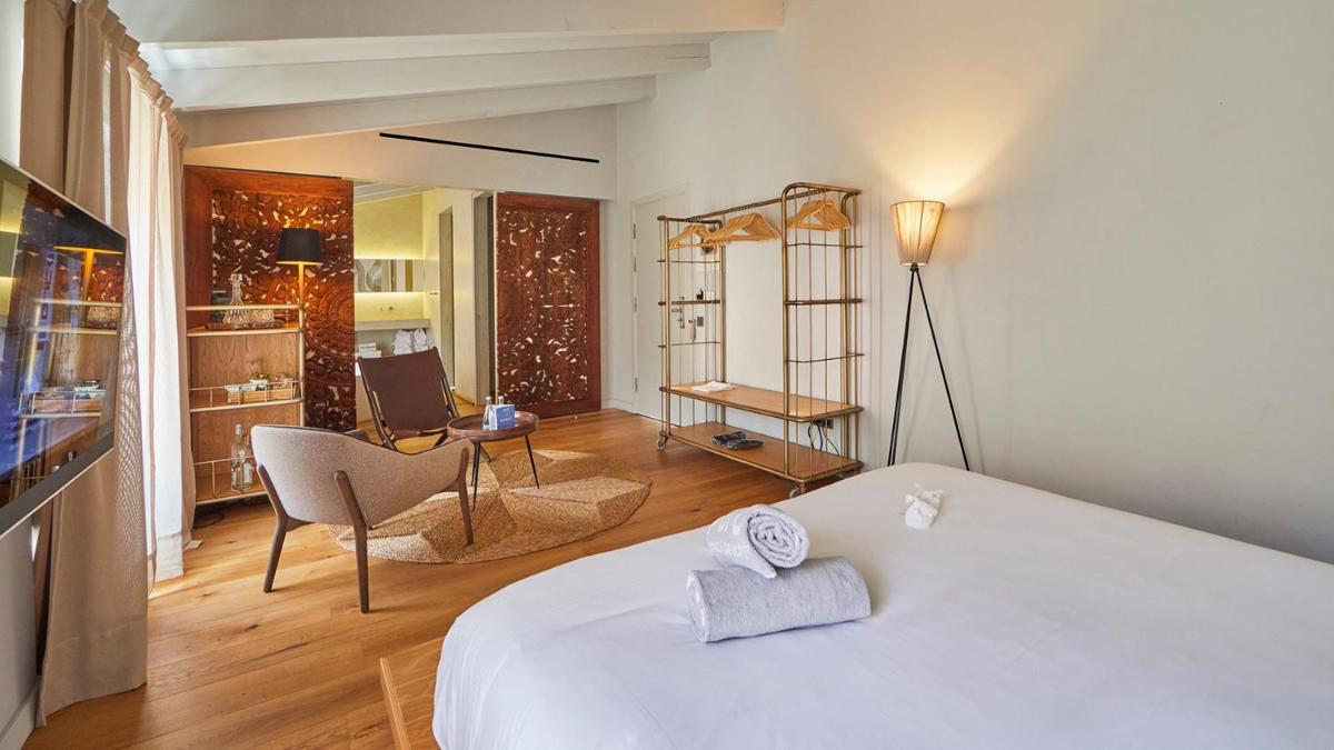Cama o camas de una habitación en Puro Hotel Oasis Urbano