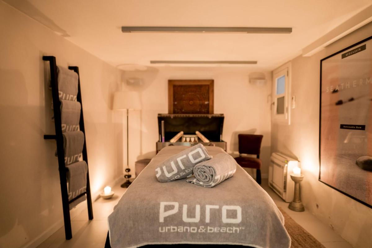 Cama o camas de una habitación en Puro Hotel Oasis Urbano