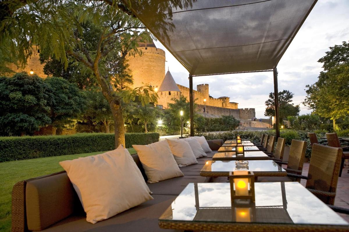 Coin salon dans l'établissement Hôtel du Château & Spa - Teritoria