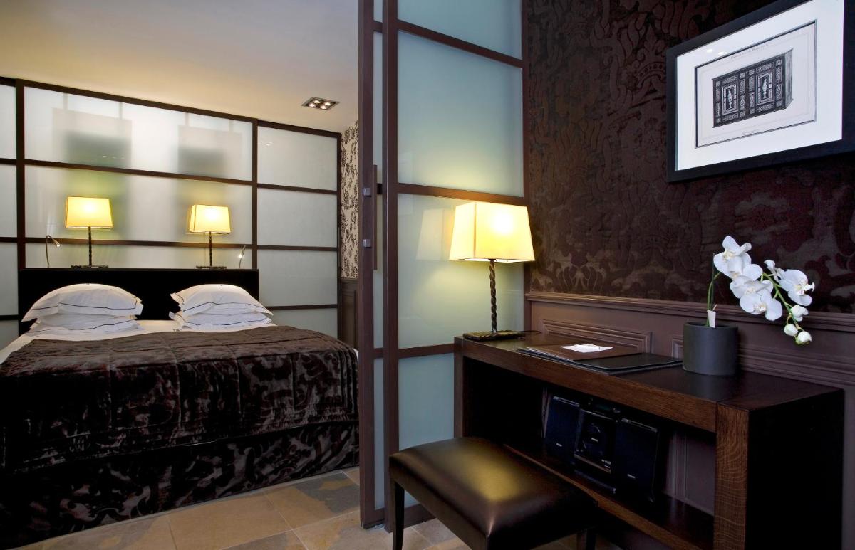 Un ou plusieurs lits dans un hébergement de l'établissement Hôtel du Château & Spa - Teritoria