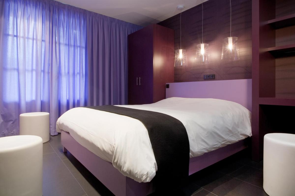 Un ou plusieurs lits dans un hébergement de l'établissement Hôtel Montmorency & Spa