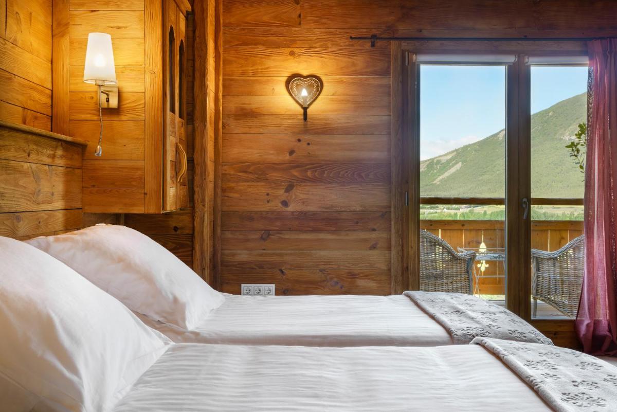 Cama o camas de una habitación en Hotel Viñas de Lárrede