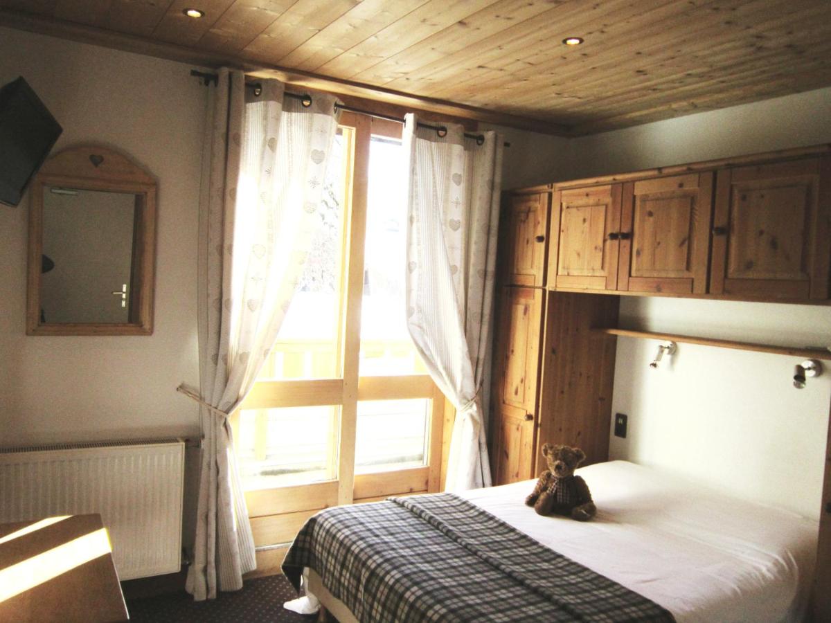 Un ou plusieurs lits dans un hébergement de l'établissement Logis Hotel Gai Soleil
