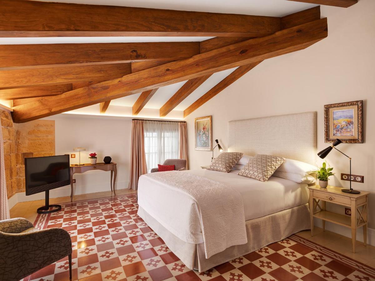 Cama o camas de una habitación en Hotel Gloria de Sant Jaume