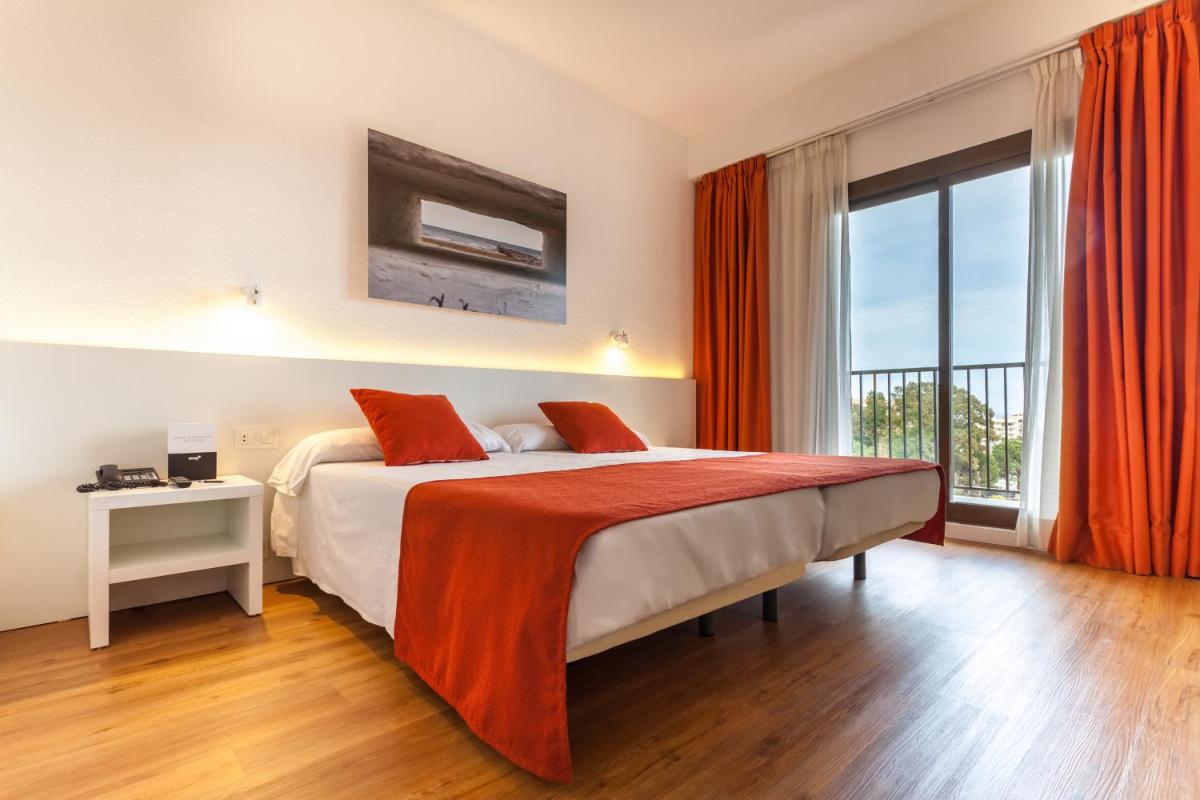 Cama o camas de una habitación en Intelier Orange