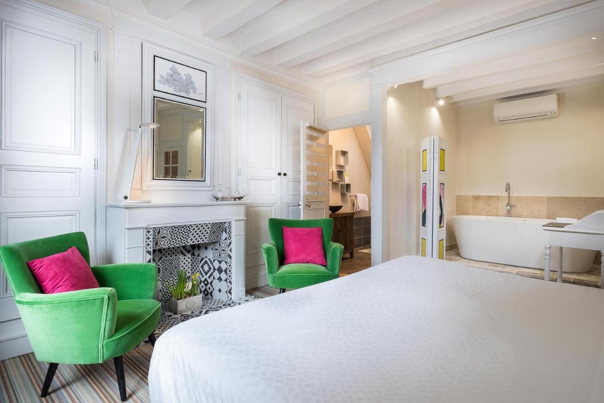 Un ou plusieurs lits dans un hébergement de l'établissement Auberge du Bon Laboureur Chenonceaux