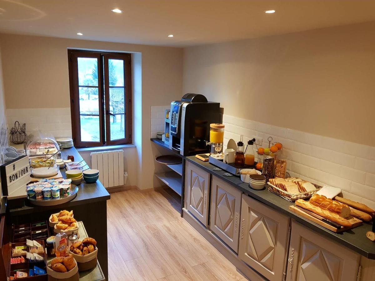 Cuisine ou kitchenette dans l'établissement Logis Hotel Archambeau