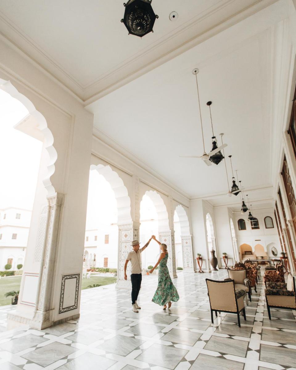 a couple dancing in the lobby of a building at The Raj Palace (Small Luxury Hotels of the World) in Jaipur