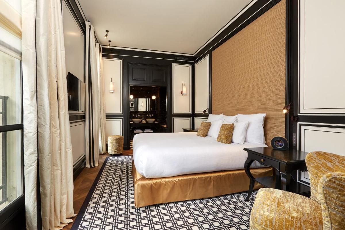 Un ou plusieurs lits dans un hébergement de l'établissement Le Pavillon de la Reine & Spa, Place des Vosges