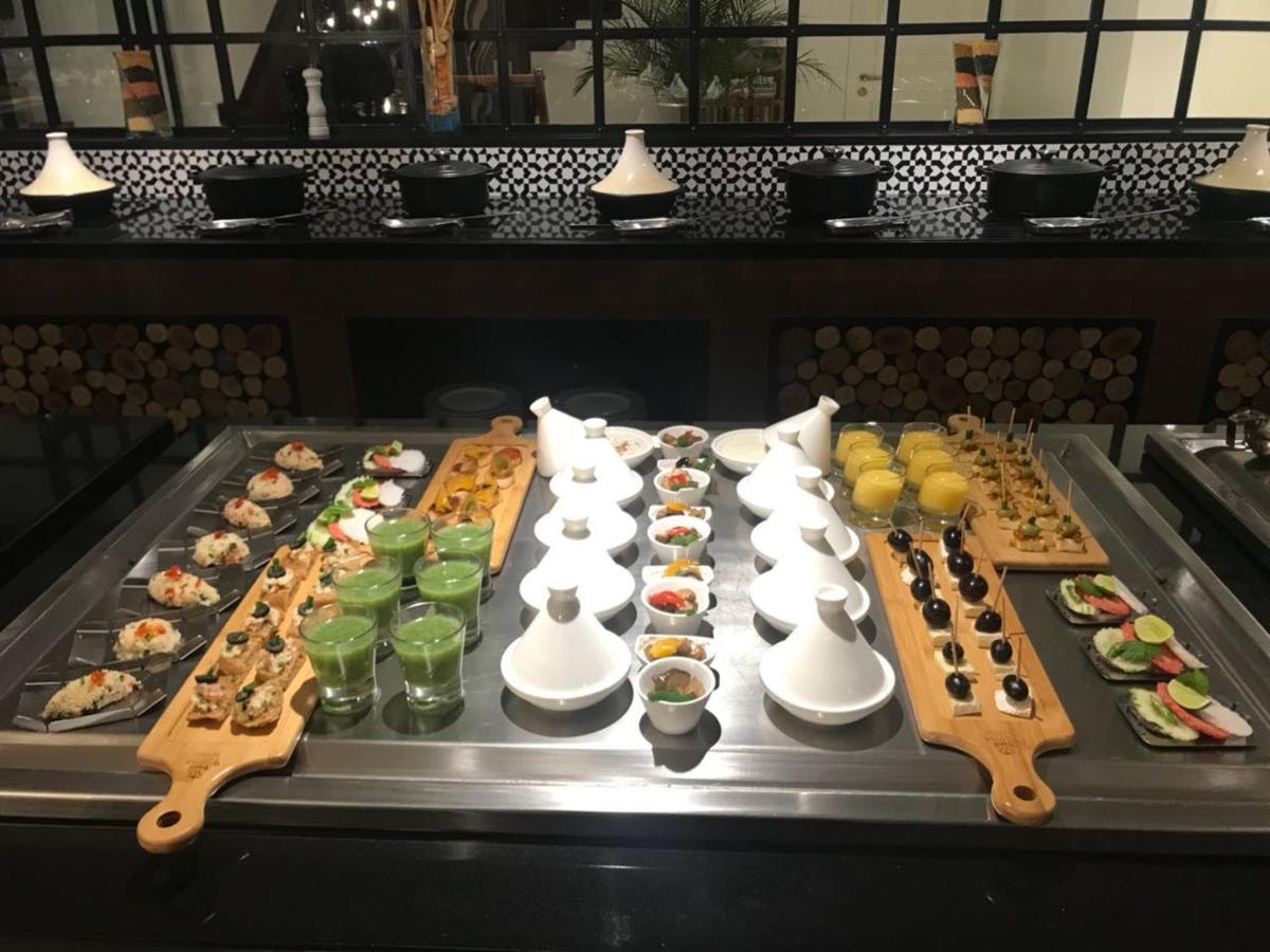 a buffet line with many different types of food at Radisson Hotel Shimla in Shimla