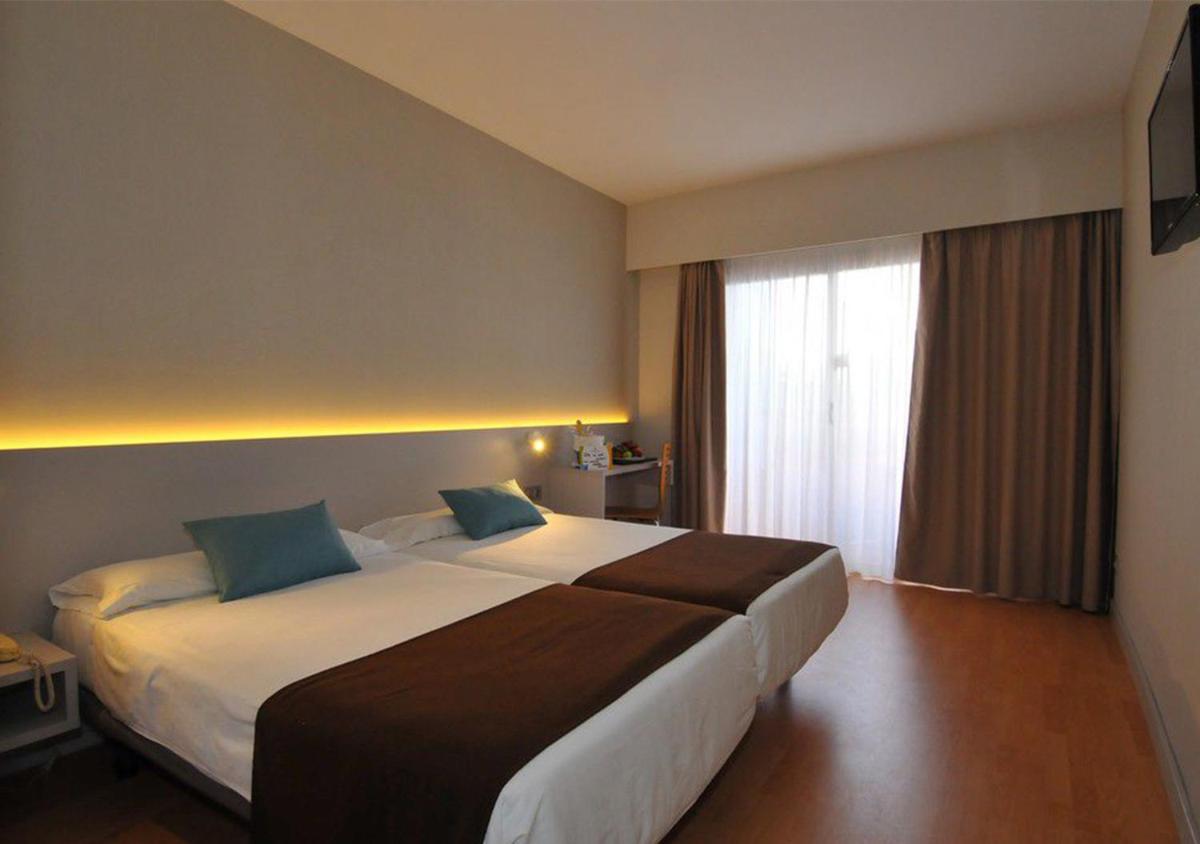Cama o camas de una habitación en Paradise Park Fun Lifestyle Hotel