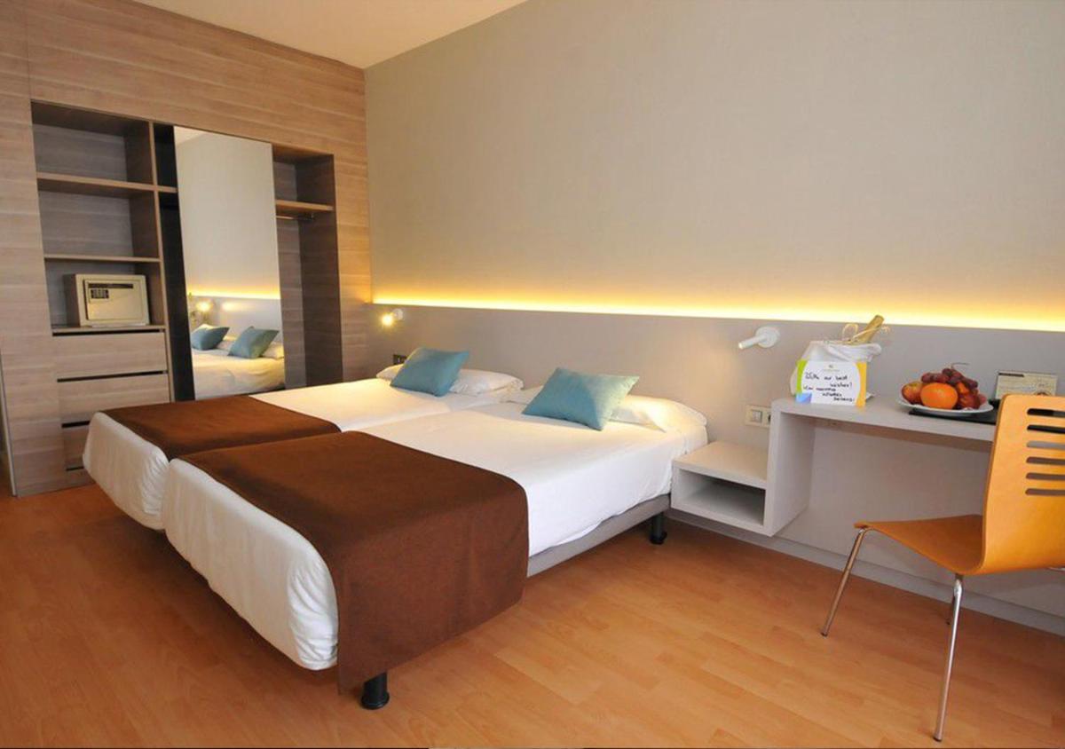 Cama o camas de una habitación en Paradise Park Fun Lifestyle Hotel