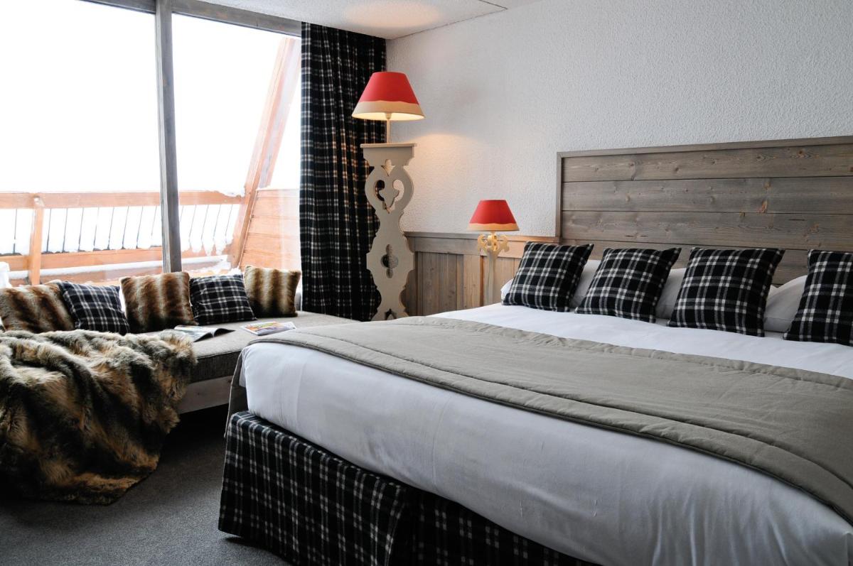 Un ou plusieurs lits dans un hébergement de l'établissement Hôtel Arcadien