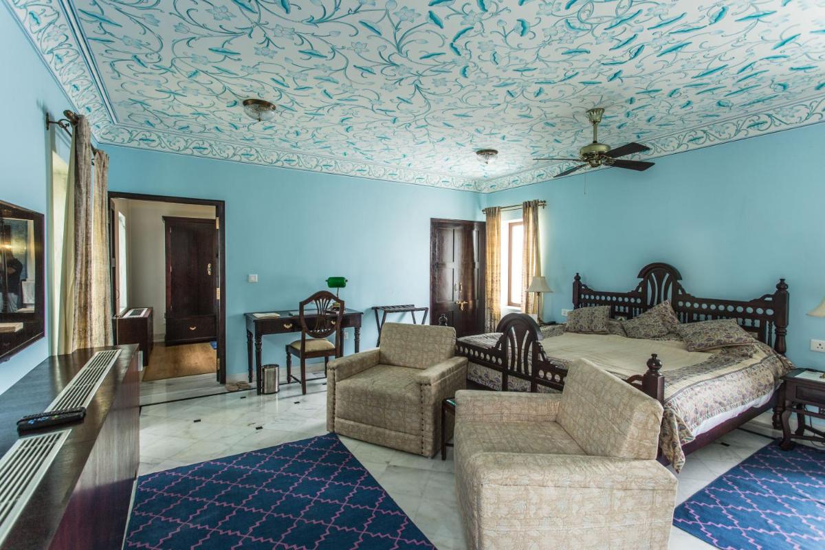 a bedroom with a bed with a coffered ceiling at Royal Heritage Haveli - By Leisure Hotels in Jaipur