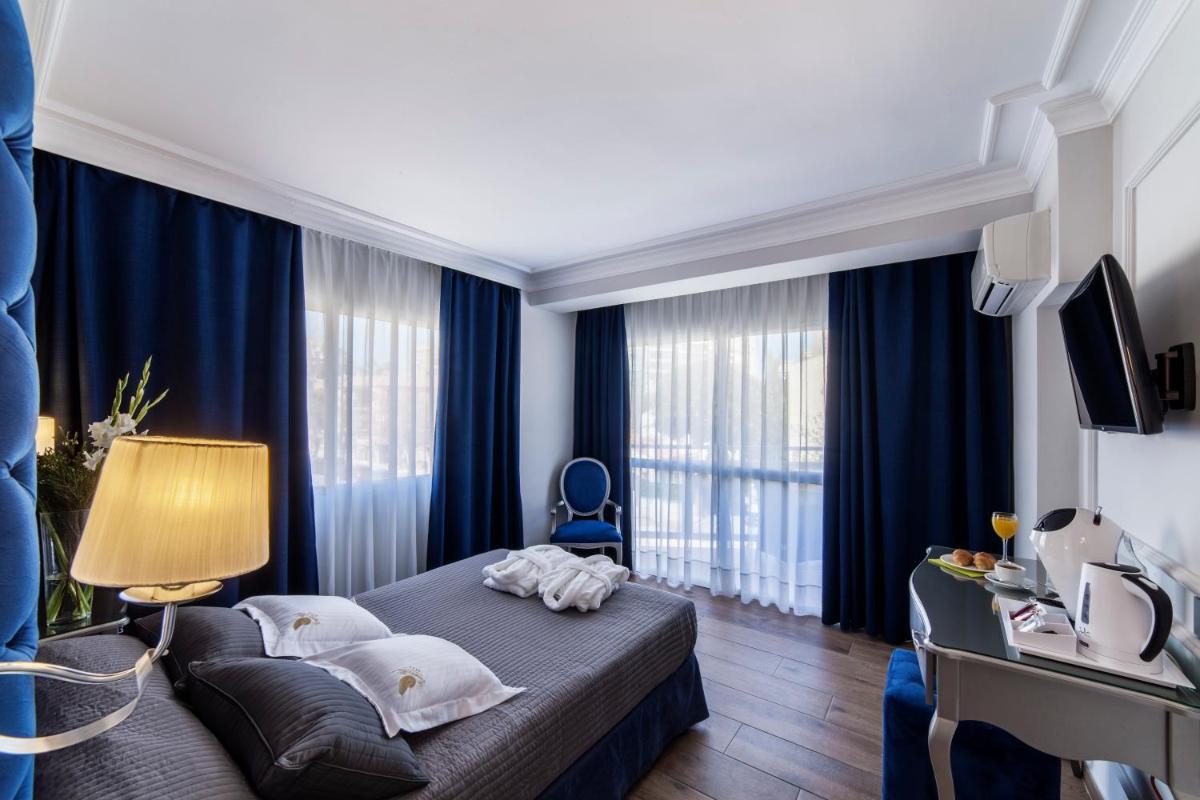 Cama o camas de una habitación en Essence Hotel Boutique