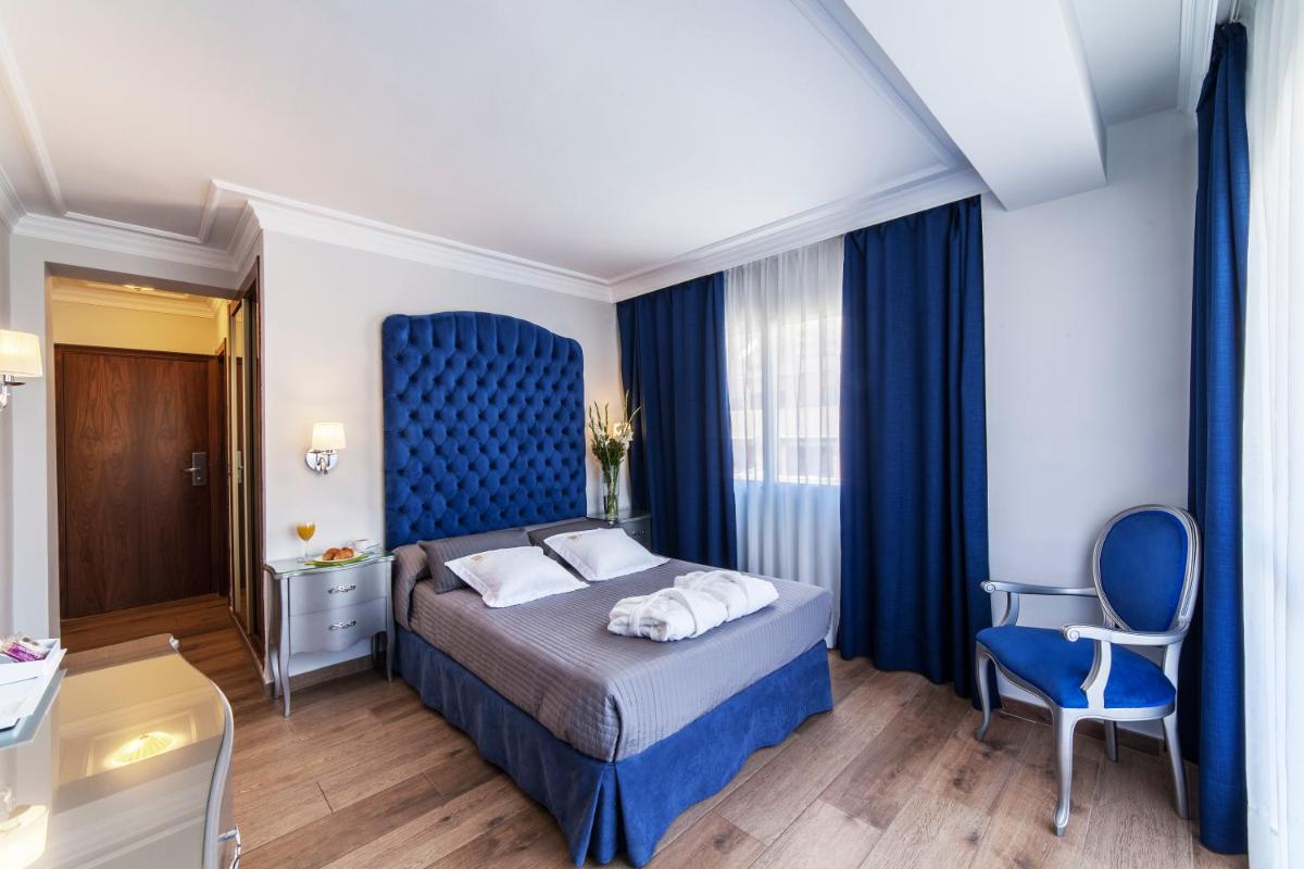 Cama o camas de una habitación en Essence Hotel Boutique