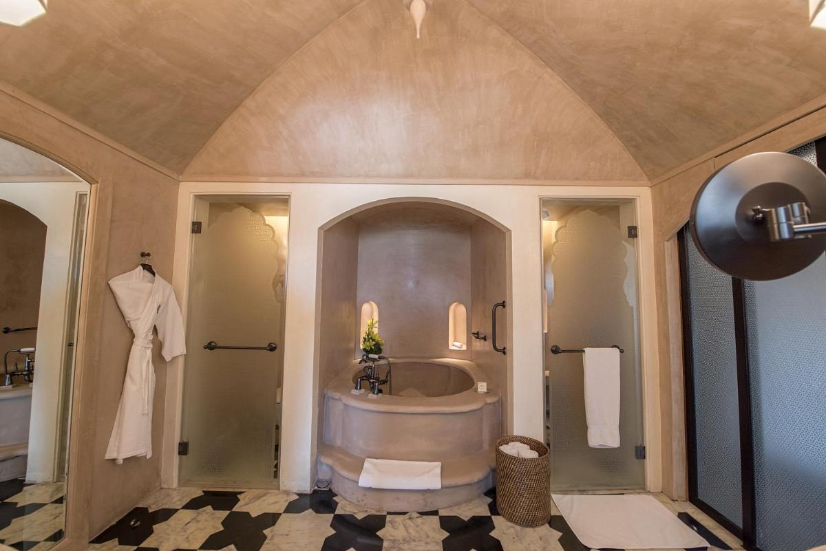 a large bathroom with a tub and a sink at Fairmont Jaipur in Jaipur