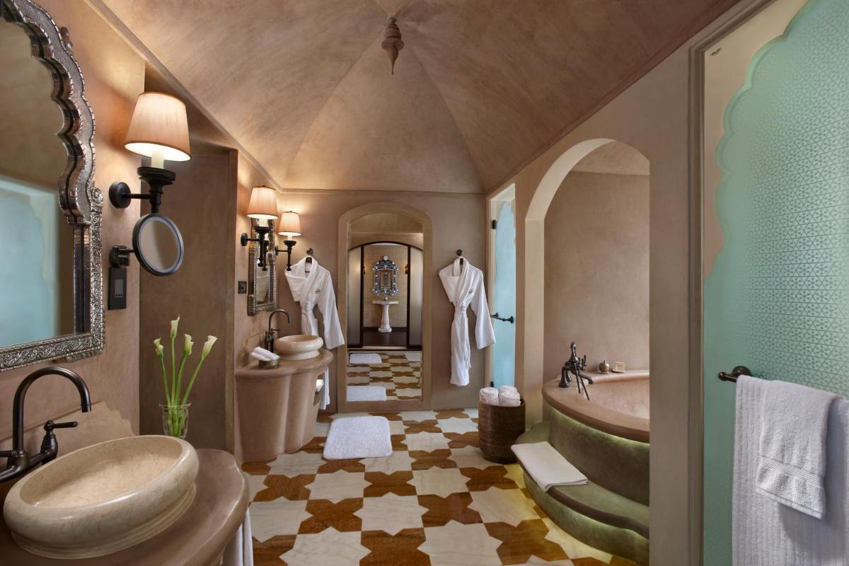 a bathroom with a sink and a tub and a toilet at Fairmont Jaipur in Jaipur