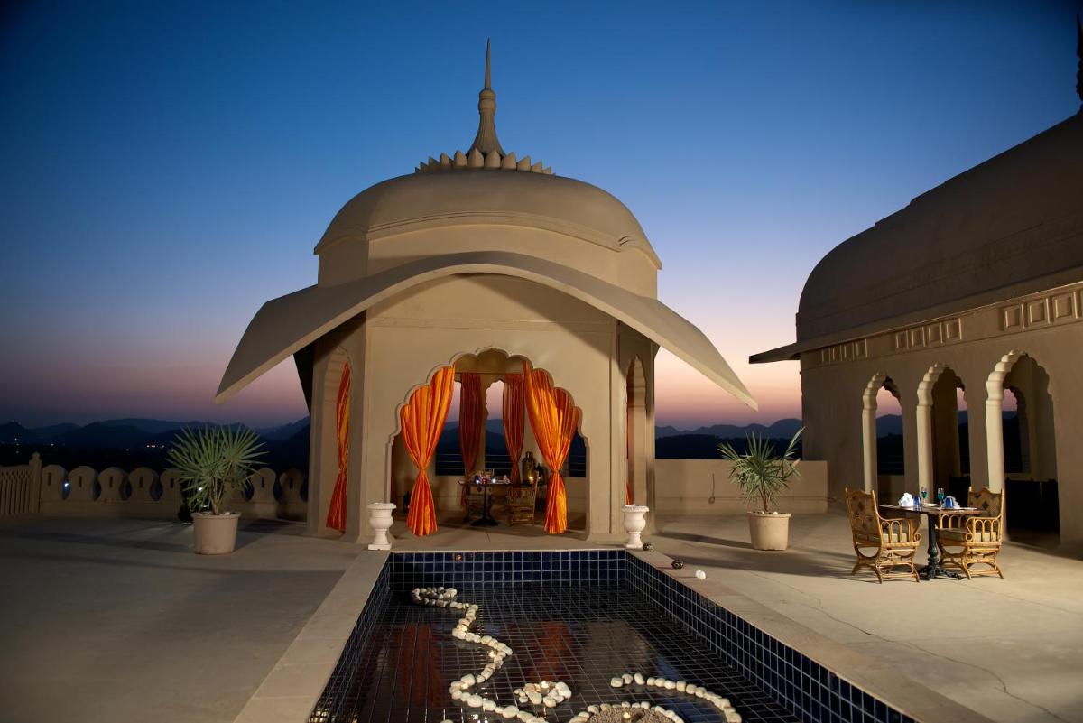 a gazebo with a pool in front of it at Fairmont Jaipur in Jaipur