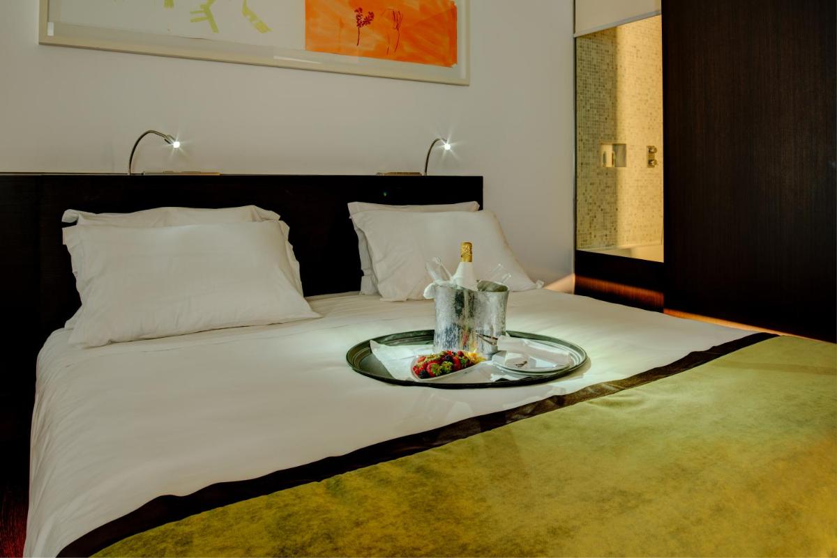 Uma cama ou camas num quarto em VIP Grand Lisboa Hotel & Spa