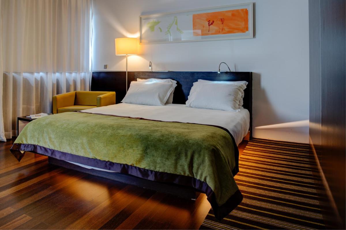 Uma cama ou camas num quarto em VIP Grand Lisboa Hotel & Spa