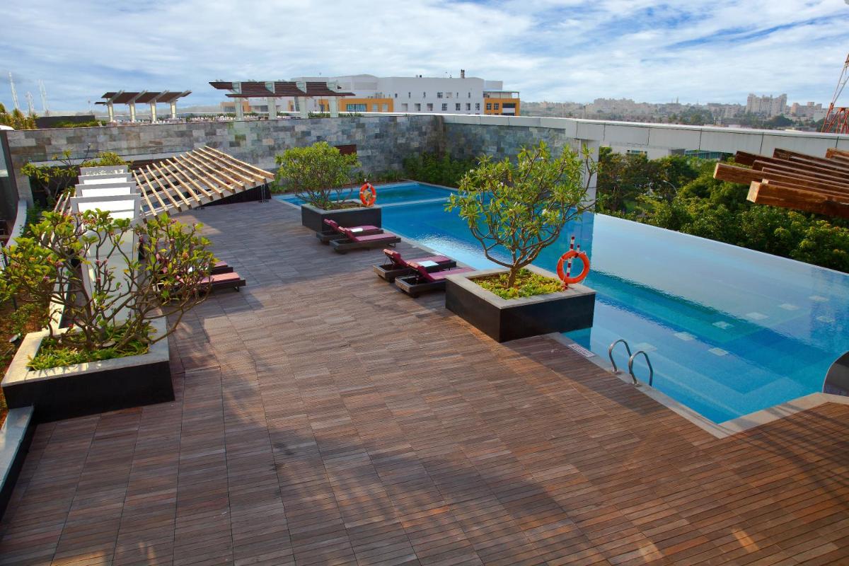 a swimming pool on the roof of a building at The Oterra in Bengaluru