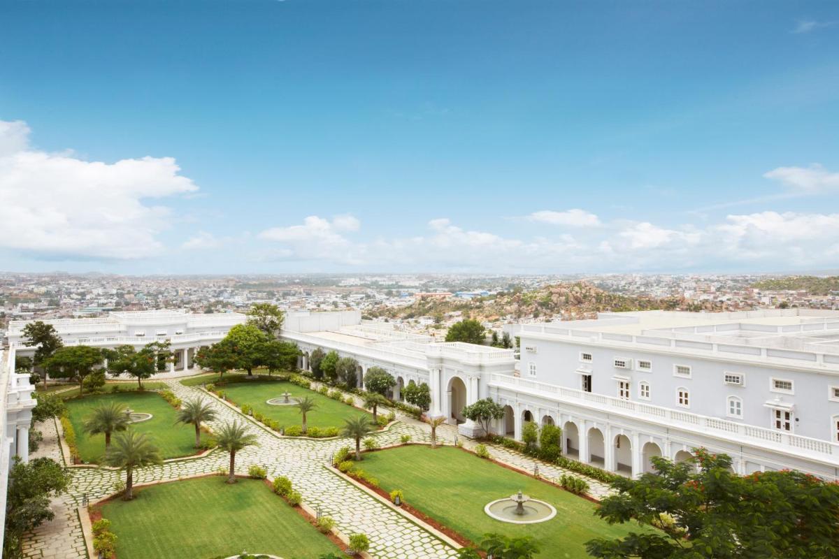 an aerial view of a white building with a park at Taj Falaknuma Palace in Hyderabad