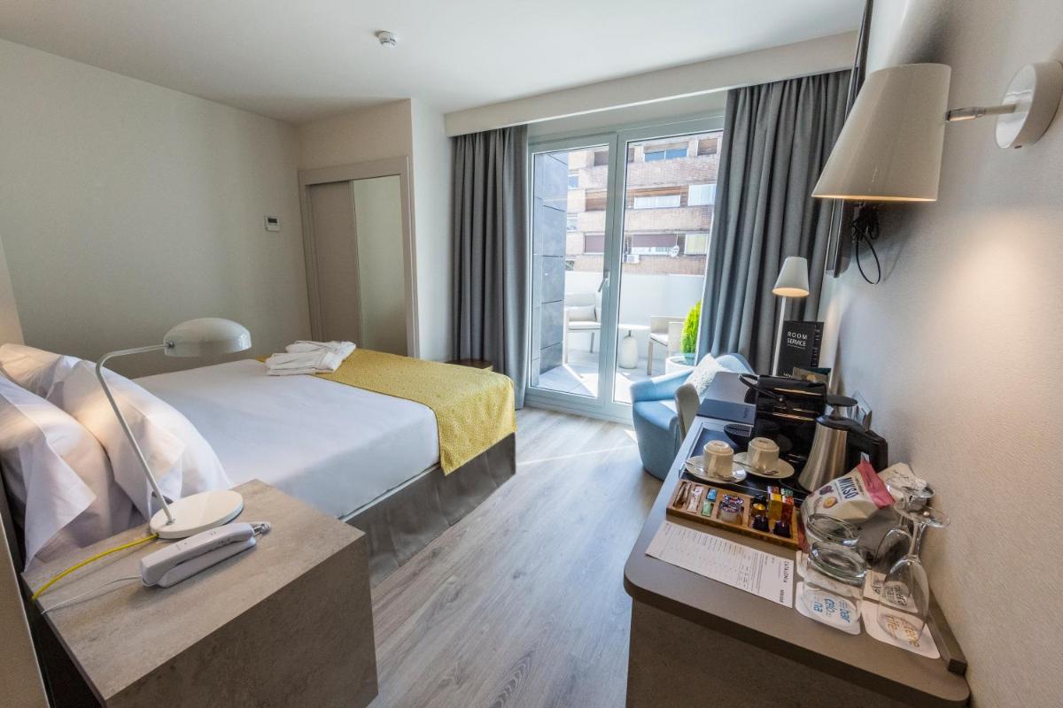 Cama o camas de una habitación en Catalonia Granada