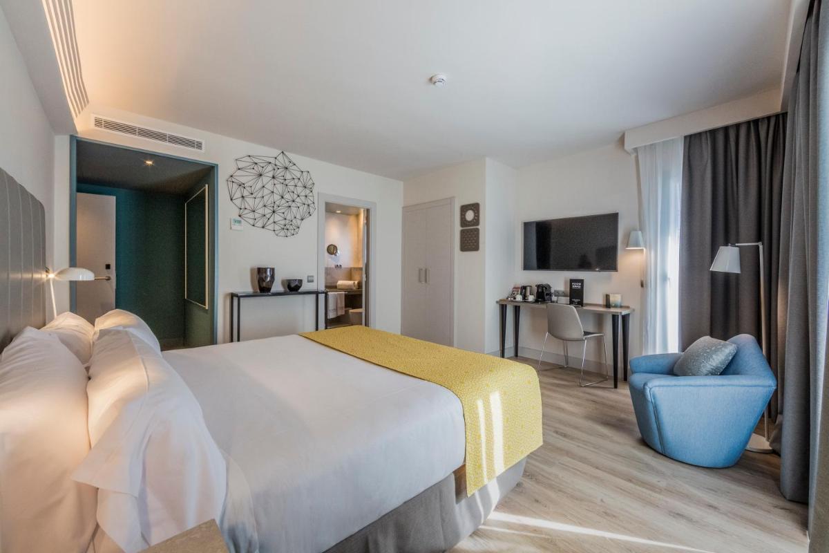 Cama o camas de una habitación en Catalonia Granada