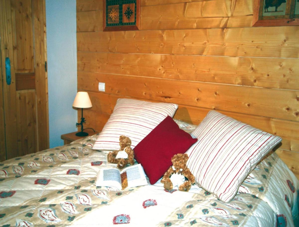 Un ou plusieurs lits dans un hébergement de l'établissement Lagrange Vacances Le Hameau du Rocher Blanc
