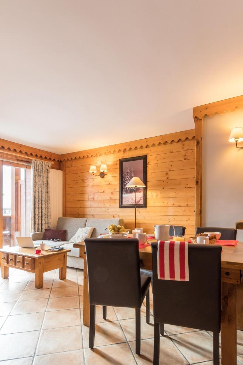 Coin salon dans l'établissement Résidence Pierre & Vacances Premium Les Hauts Bois