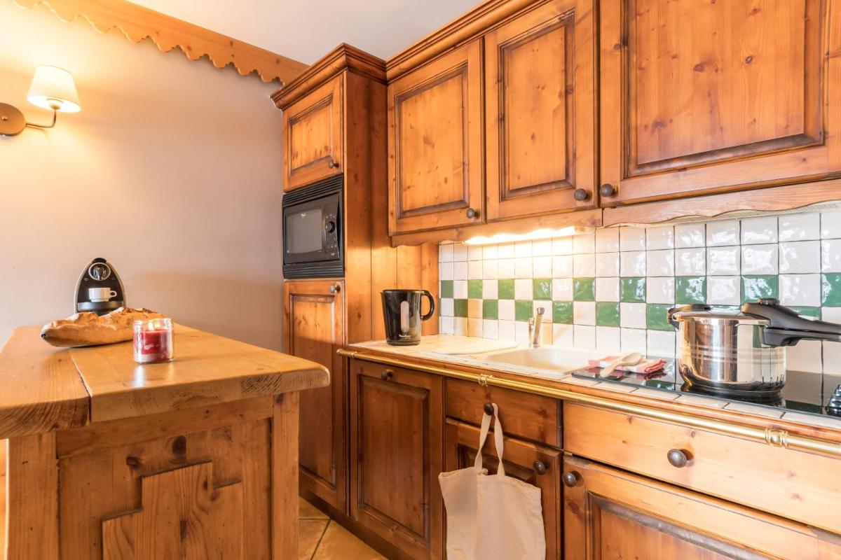 Cuisine ou kitchenette dans l'établissement Résidence Pierre & Vacances Premium Les Hauts Bois
