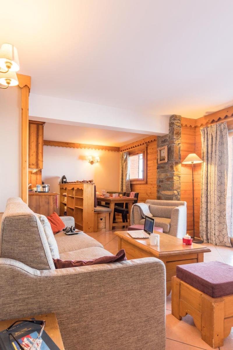 Coin salon dans l'établissement Résidence Pierre & Vacances Premium Les Hauts Bois