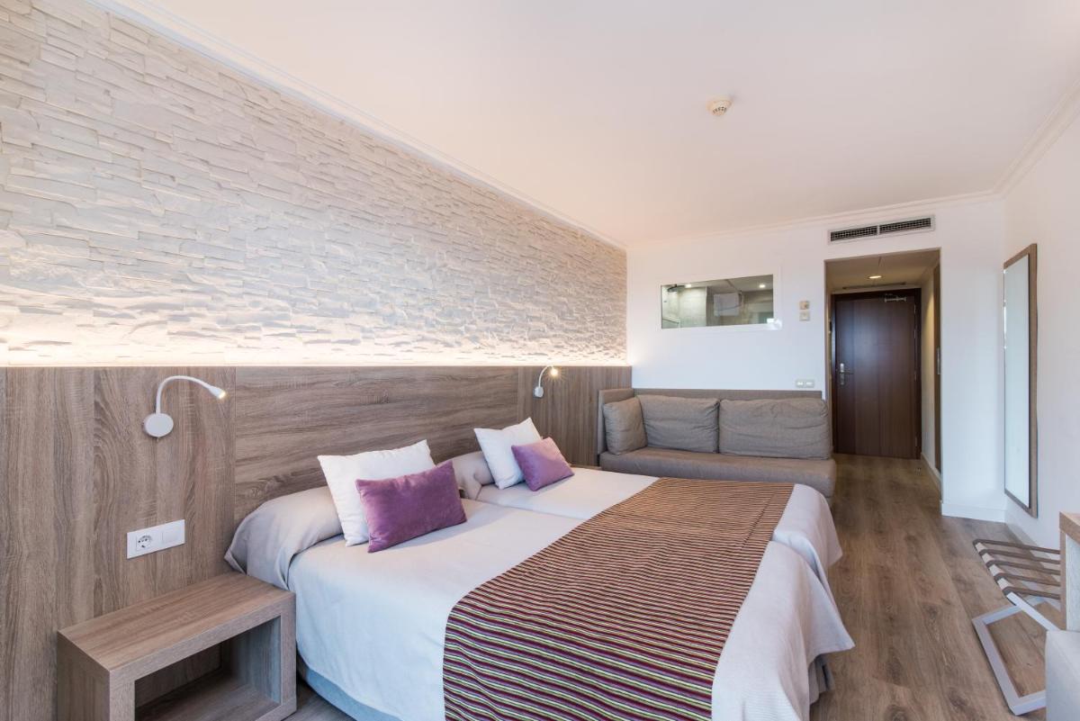 Cama o camas de una habitación en Hotel Na Taconera
