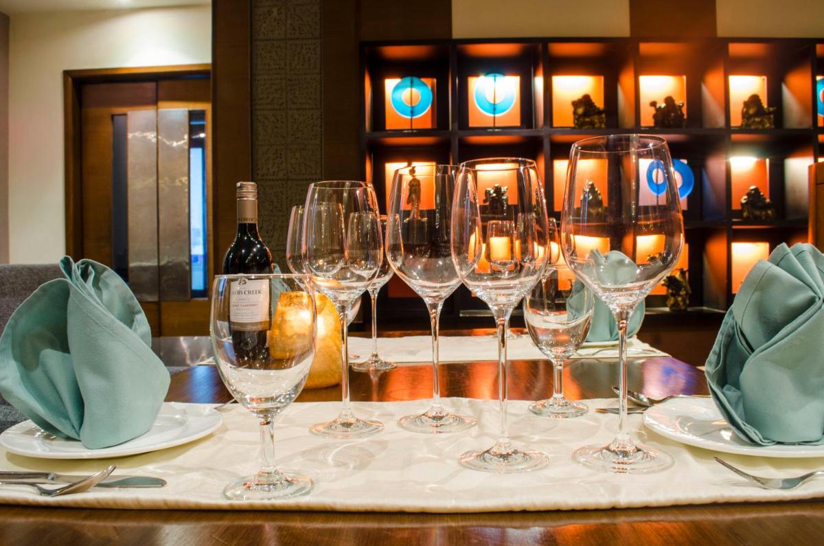 a group of wine glasses sitting on a table at Radisson Blu Hotel, Greater Noida in Greater Noida